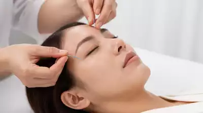 User using acupuncture for eye treatment