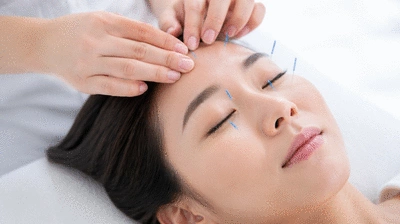 User receiving acupuncture treatment for eye health